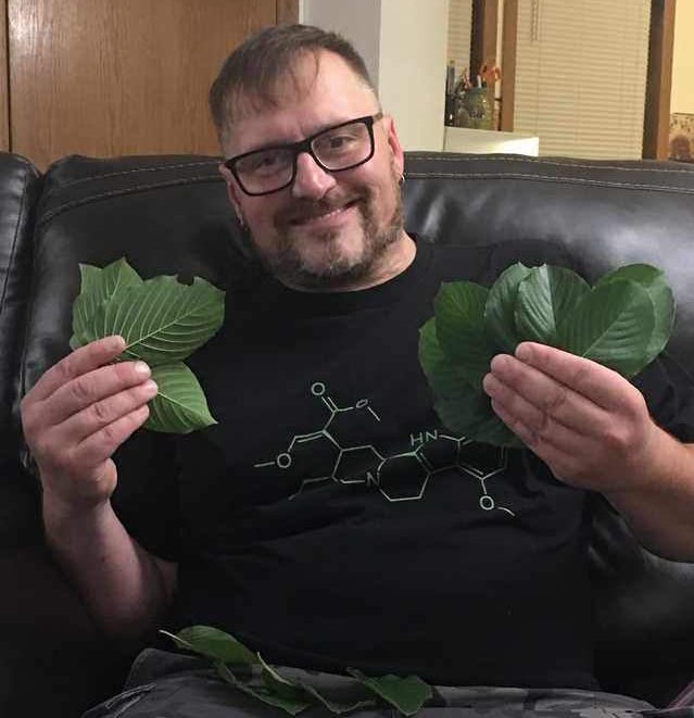 Customer holding fresh Kratom leaf